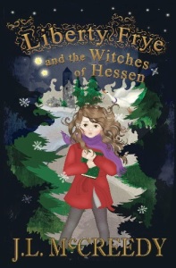 Cover of "Liberty Frye and the Witches of Hessen," featuring a drawing of a girl in a red coat holding a book walking through a snowy pine forest