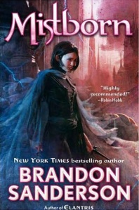 Cover of "Mistborn," featuring a girl with short dark hair wearing a flowing gray cloak; a tall spire is in the background