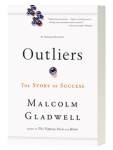 Cover of "Outliers," featuring dark text on a white background with a small purple marble in the middle