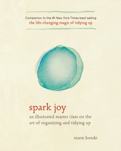Cover of "Spark Joy," featuring a blue circle done in what looks like watercolor paint on a cream background