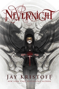 Cover of "Nevernight," featuring a pale white person with black hair holding a bloody knife. The shadow on the wall behind them looks like wings.
