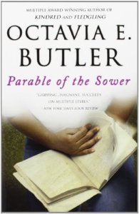 Cover of "Parable of the Sower," featuring a pair of medium-brown hands holding an open book.