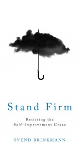 Cover of "Stand Firm," feauring a black raincloud with a handle coming from it so it looks like an umbrella.