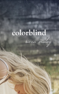 Cover of "Colorblind," featuring a white person with long blond hair with a forest behind her. The image is rotated so the trees seem to be growing horizontally.