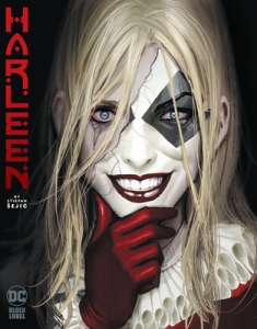Cover of "Harleen" featuring a woman with long blonde hair holding a grinning harlequin mask in front of her face; the mask is broken and reveals one eye with dark smears of makeup beneath it, like she had been crying and the tears had smudged her mascara.