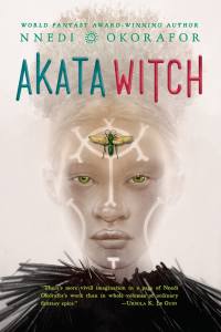 Cover of Akata Witch, featuring a Black albino girl staring straight ahead with white paint designs on her forehead and cheeks.
