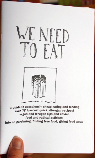 Cover of "We Need to Eat," featuring a black and white hand-drawn image of a bunch of asparagus.
