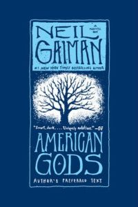 Cover of American Gods, featuring a blue silhouette of a leafless tree with spreading branches on a white background.
