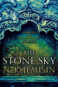 Cover of "The Stone Sky," featuring a stone arch with intricate carvings and a solid wall of rough stone behind it.