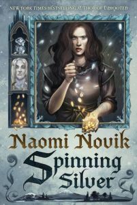 Cover of "Spinning Silver," featuring a dark-haired girl with a cold look on her face dropping coins from one hand to the other; as they fall out of her top hand they are silver, but by the time they reach her bottom hand they have turned into gold.