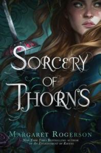 Cover of the book, featuring a blonde girl in a green dress holding a sword. The image is very close and only part of the girl's face and shoulder and some of the blade can be seen 