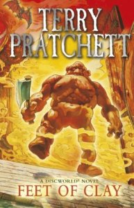 Cover of the book, featuring a stocky humanoid shape made of red clay holding an axe and walking through swirls of orange and yellow smoke.