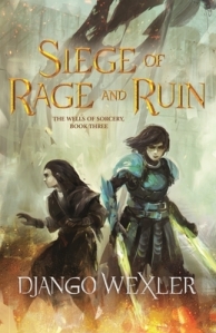 Cover of the book, featuring two dark-haired girls: On the left, a shorter one in dark robes with empty hands, and on the right, a taller one in dark clothes covered with blue armor who has sword-like blades of green energy coming from her hands. Behind them a wall can barely be seen through fog; around their feet, fire burns.