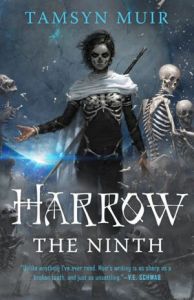 Cover of the book, featuring a woman with short black hair wearing black clothes; her face is painted into a skull, she has a ribcage and a pelvis around her body like armor, and she has a white cloak over her shoulders and a large sword strapped to her back. Behind her are animated skeletons, and the woman's hand is extended like she is bringing them to life.