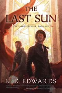 Cover of the book, featuring a brown-haired young man with glowing eyes; behind him is a second young man with reddish hair holding a handgun.